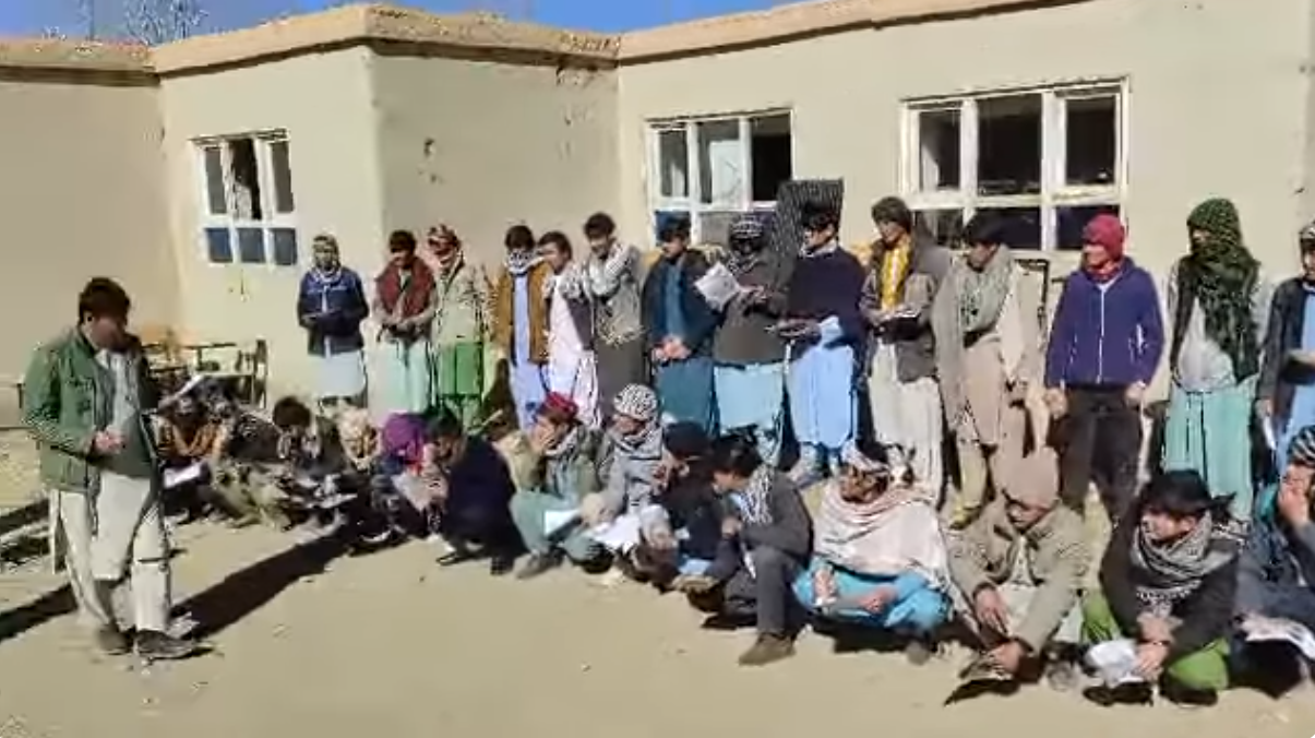 Kabir Bigzad, a volunteer from Lal wa Sarjangal District of Ghor Province, distributing seeds and providing guidance on planting mountain forest seeds.